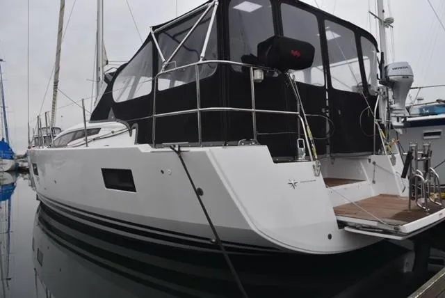 2016 Jeanneau 54 yacht docked, featuring sleek design and modern amenities.