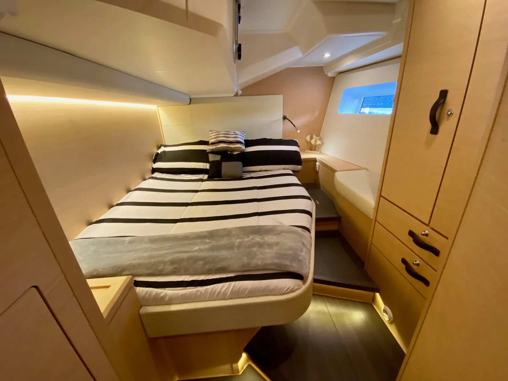 Luxurious cabin interior of a 2016 Jeanneau 54 yacht with modern furnishings.