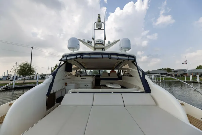 Blue Tang Gang Yacht Photos Pics 2005 Viking Princess 58V yacht, rear view, docked with spacious deck and modern design.