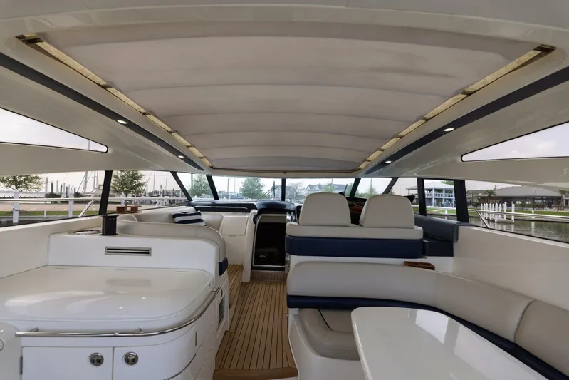 Blue Tang Gang Yacht Photos Pics Luxurious interior of a 2005 Viking Princess 58V yacht with elegant seating and modern design.