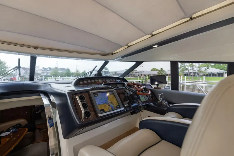 Blue Tang Gang Yacht Photos Pics Interior view of 2005 Viking Princess 58V yacht cockpit with navigation equipment.