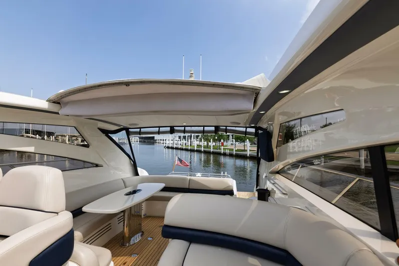 Blue Tang Gang Yacht Photos Pics Luxurious 2005 Viking Princess 58V yacht interior with elegant seating and waterfront view.