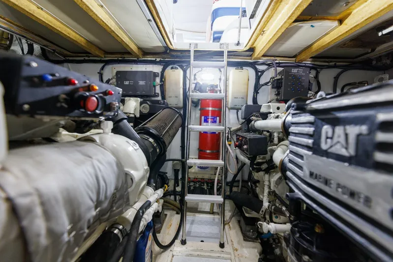 Blue Tang Gang Yacht Photos Pics Engine room of 2005 Viking Princess 58V yacht with CAT marine engines.