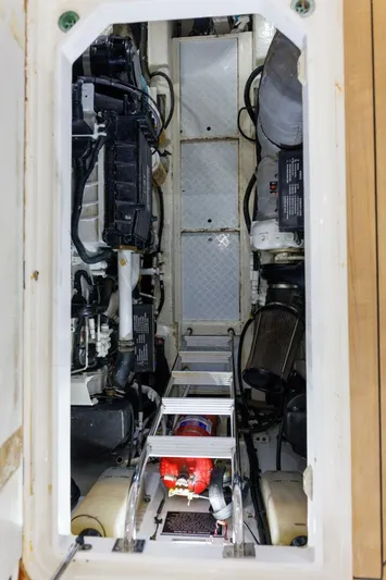 Blue Tang Gang Yacht Photos Pics Engine room of 2005 Viking Princess 58V yacht, showcasing mechanical components and equipment.