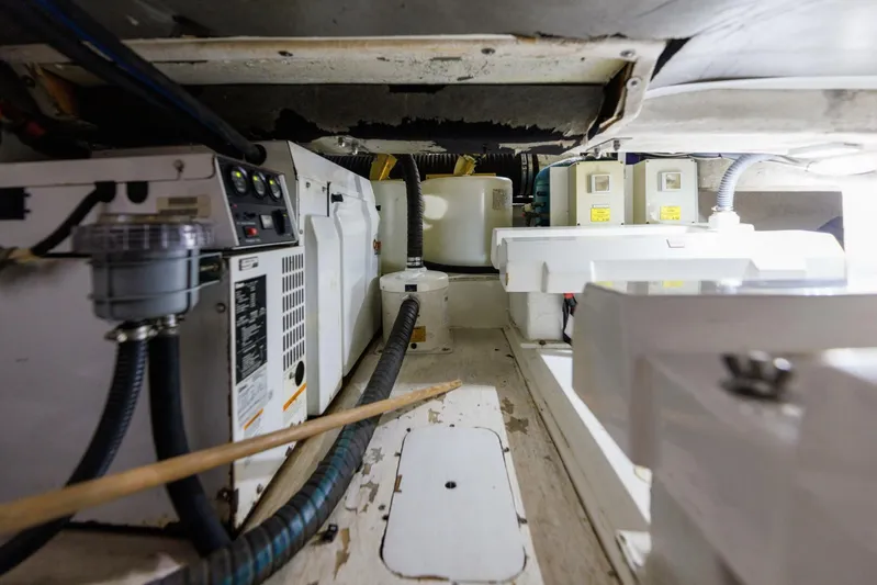 Blue Tang Gang Yacht Photos Pics Engine room of 2005 Viking Princess 58V yacht, showcasing equipment and wiring.