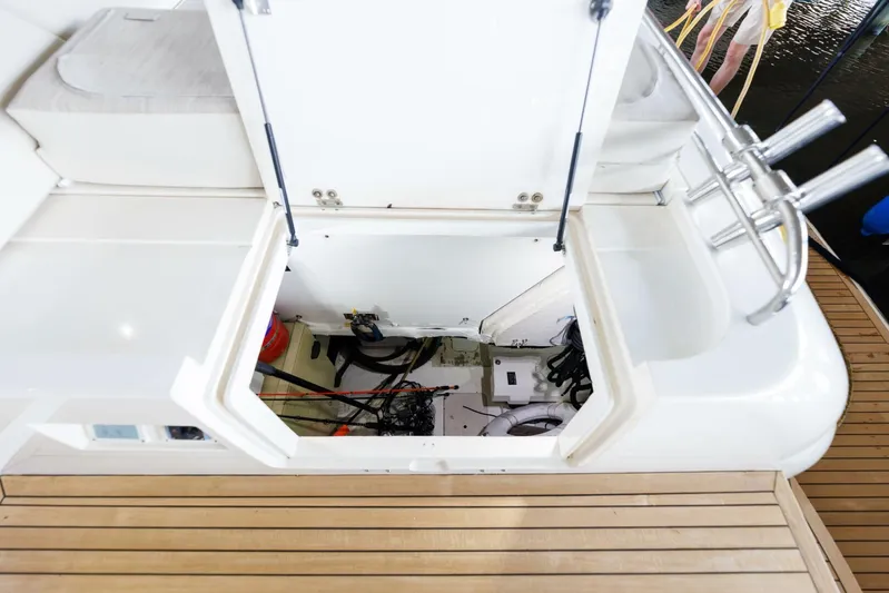 Blue Tang Gang Yacht Photos Pics Open hatch on 2005 Viking Princess 58V yacht, revealing engine compartment.