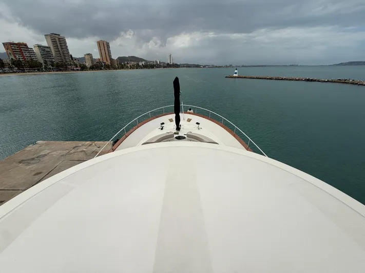  Yacht Photos Pics Apreamare 65 MAESTRO yacht docked, overlooking a coastal cityscape, 2011 model.