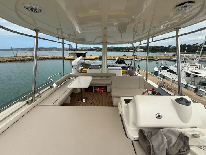  Yacht Photos Pics Luxurious 2011 Apreamare 65 MAESTRO yacht interior with spacious seating and scenic marina view.