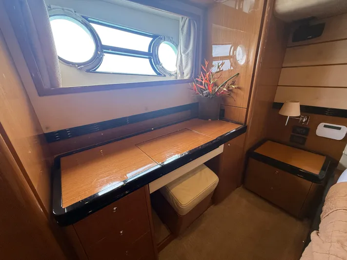  Yacht Photos Pics Luxurious interior of 2011 Apreamare 65 MAESTRO yacht with elegant wood finish and porthole windows.