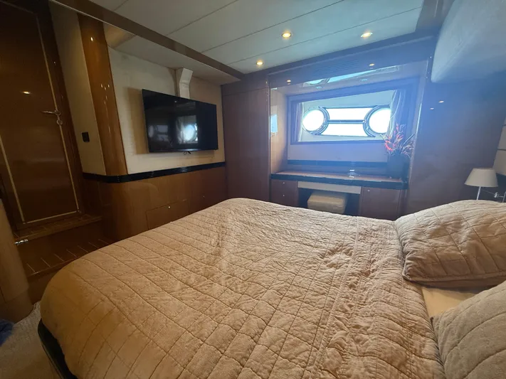  Yacht Photos Pics Luxurious bedroom interior of 2011 Apreamare 65 MAESTRO yacht with porthole window.