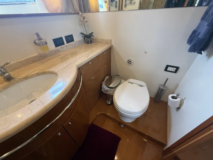  Yacht Photos Pics Luxurious bathroom in 2011 Apreamare 65 MAESTRO yacht with elegant fixtures and wooden cabinetry.