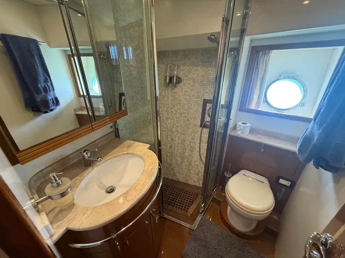  Yacht Photos Pics Bathroom interior of 2011 Apreamare 65 MAESTRO yacht with shower and porthole window.