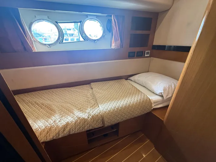  Yacht Photos Pics Cabin interior of 2011 Apreamare 65 MAESTRO yacht with single bed and porthole windows.