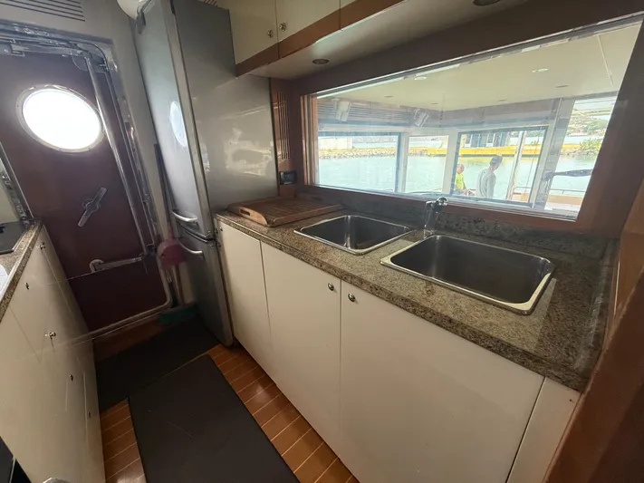  Yacht Photos Pics Interior of 2011 Apreamare 65 MAESTRO yacht kitchen with dual sinks and large window.