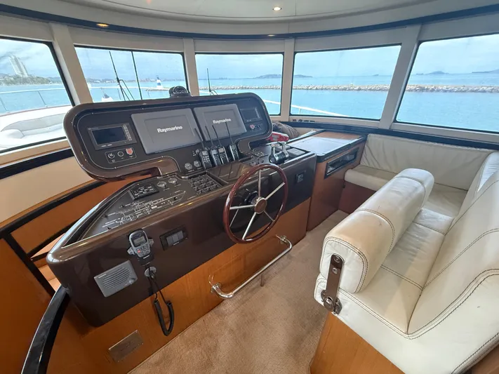  Yacht Photos Pics Helm of 2011 Apreamare 65 MAESTRO yacht with leather seating and navigation equipment.