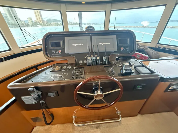  Yacht Photos Pics Helm of 2011 Apreamare 65 MAESTRO yacht with navigation equipment and steering wheel.