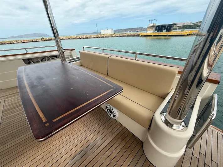  Yacht Photos Pics Luxury seating area on 2011 Apreamare 65 MAESTRO yacht with wooden table.