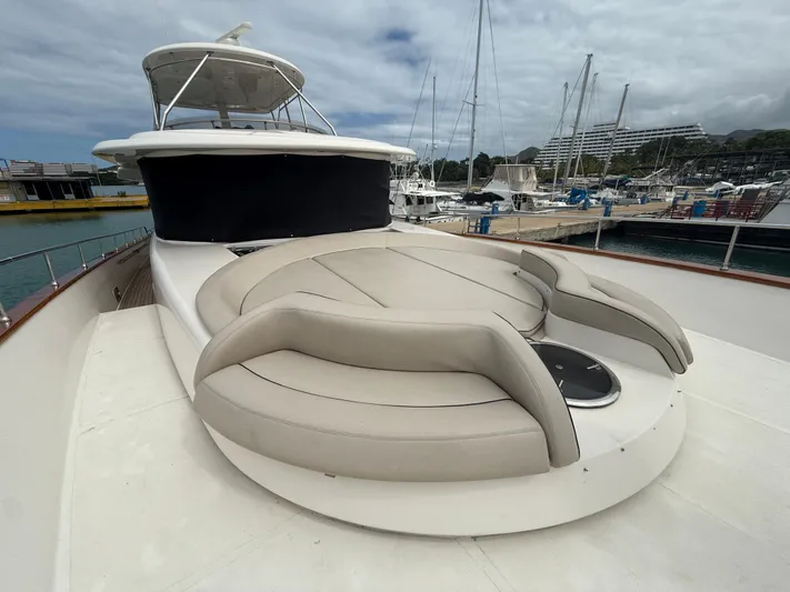  Yacht Photos Pics Apreamare 65 MAESTRO 2011 yacht with spacious deck and seating area in marina.