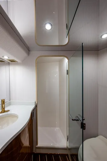 Carolina Style Yacht Photos Pics 2012 Viking 60 Enclosed Bridge yacht bathroom with modern fixtures and glass shower.
