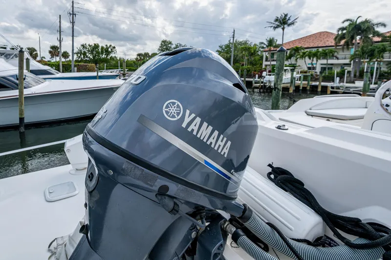 Carolina Style Yacht Photos Pics Yamaha outboard motor on a 2012 Viking 60 Enclosed Bridge boat, docked in a marina.