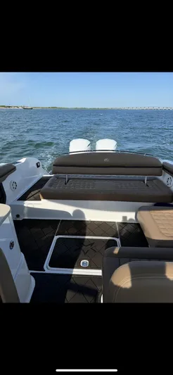  Yacht Photos Pics 2020 Cobalt 30SC Outboard boat interior with seating, on open water.
