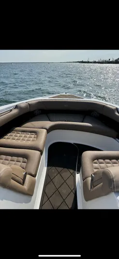  Yacht Photos Pics 2020 Cobalt 30SC Outboard boat interior with cushioned seating on open water.