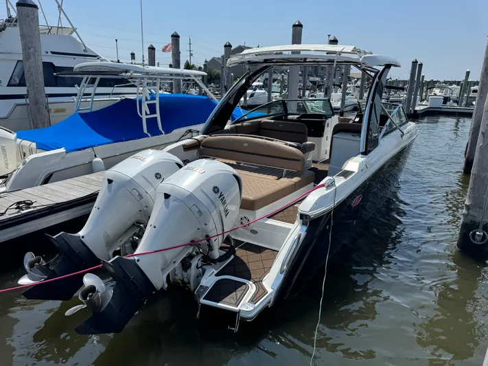  Yacht Photos Pics 2020 Cobalt 30SC Outboard boat docked with twin Yamaha engines.