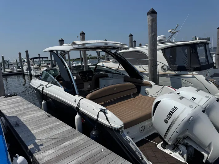  Yacht Photos Pics 2020 Cobalt 30SC Outboard boat docked with Yamaha engines, featuring sleek design and spacious seating.