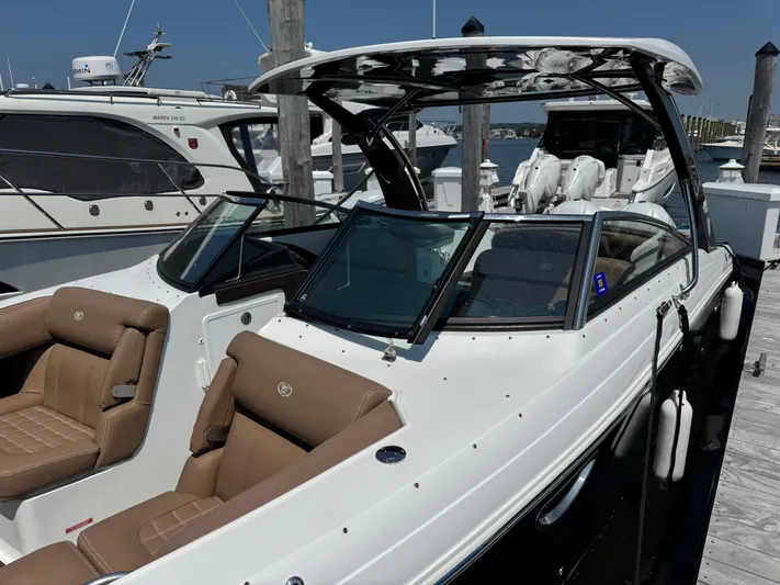  Yacht Photos Pics 2020 Cobalt 30SC Outboard boat docked, featuring sleek design and comfortable seating.