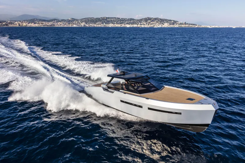  Yacht Photos Pics 2025 Mazu Yachts Mazu 52 cruising on open sea, showcasing sleek design and speed.