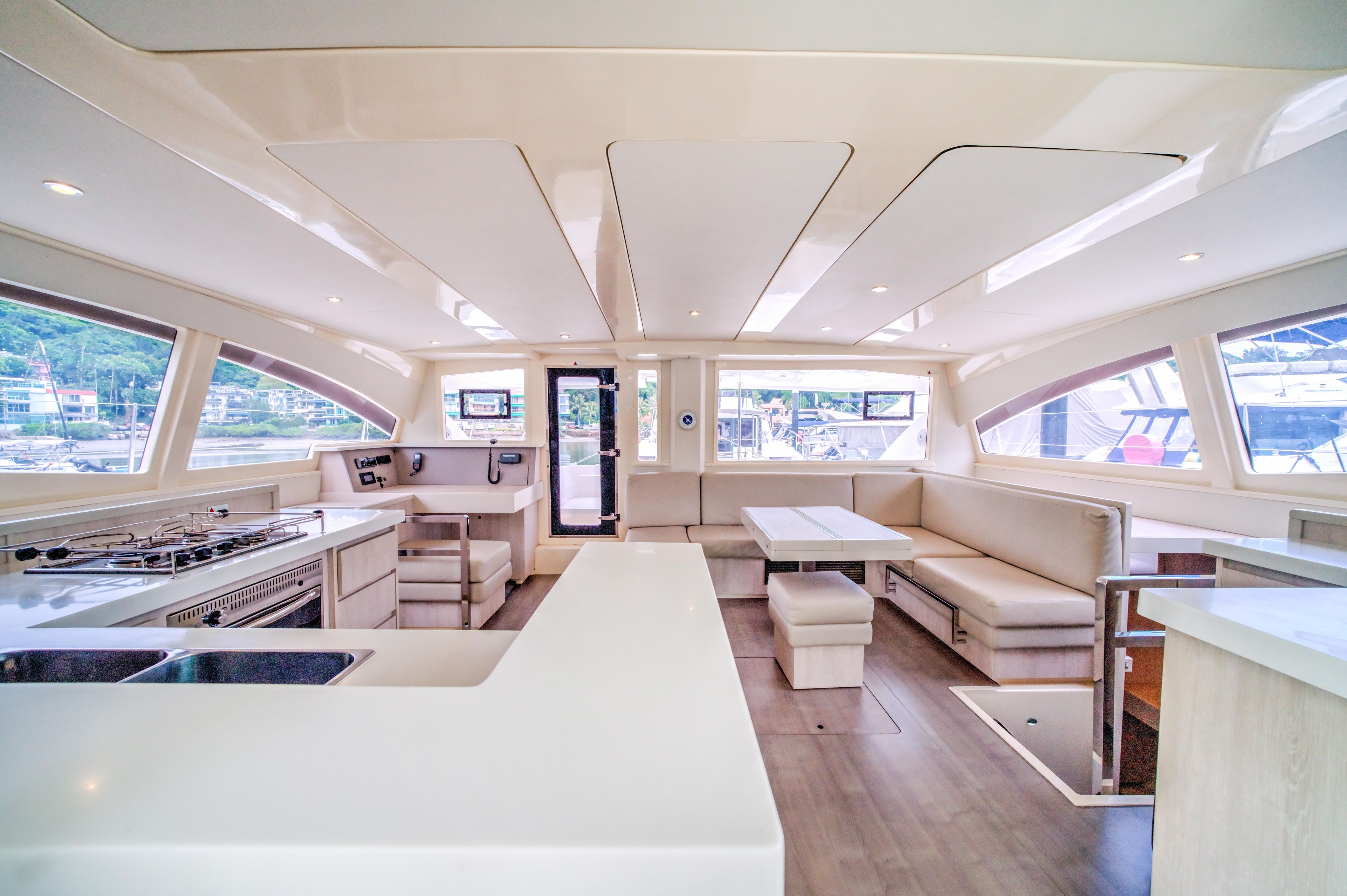 Luxurious interior of a 2015 Leopard 48 yacht with modern kitchen and seating area.