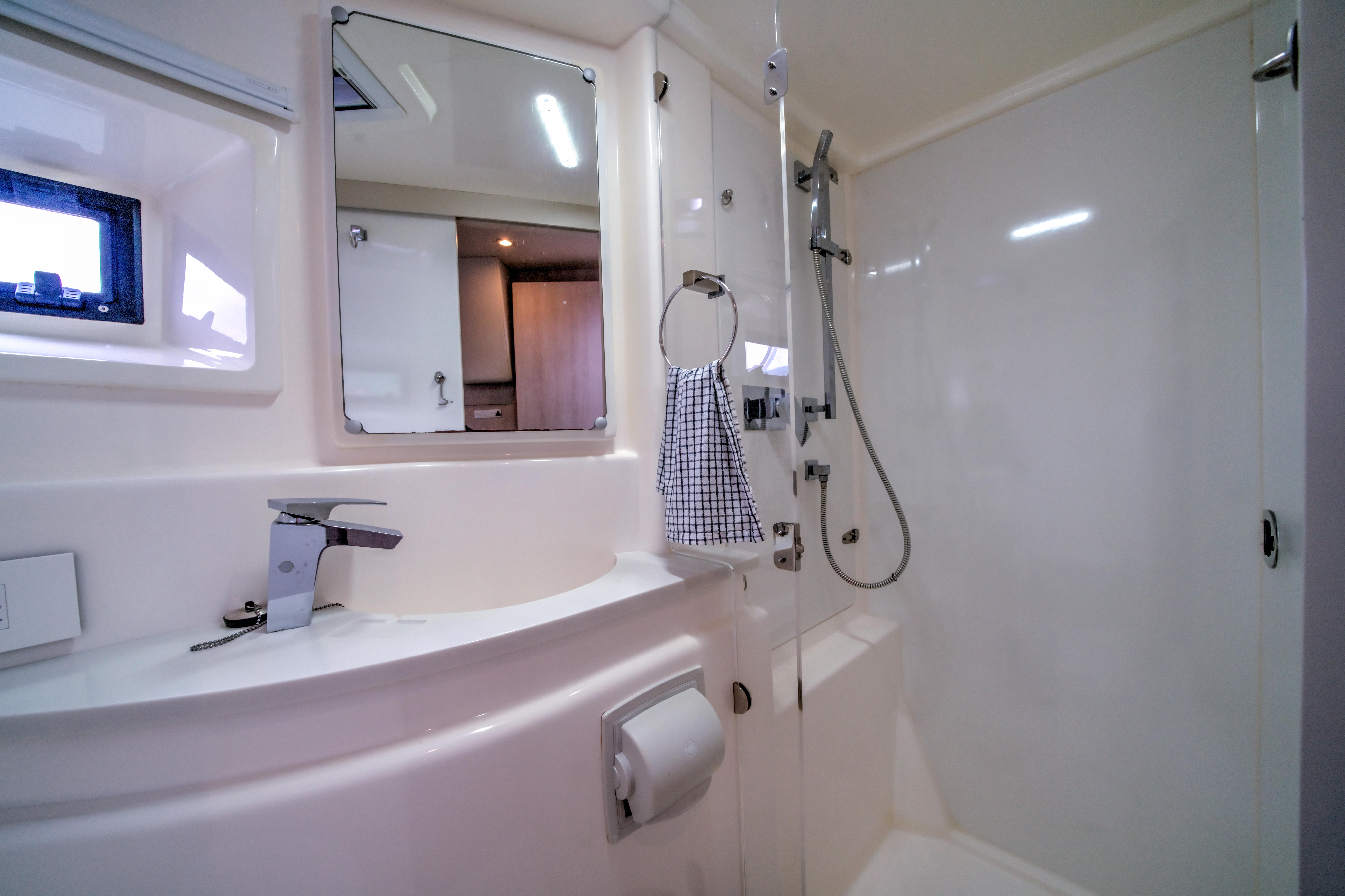 Luxurious bathroom in a 2015 Leopard 48 yacht, featuring modern fixtures and sleek design.