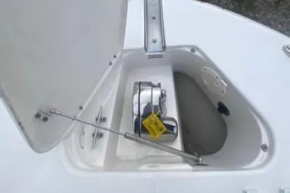  Yacht Photos Pics 2022 Robalo R302 Center Console boat anchor compartment with open hatch.
