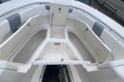  Yacht Photos Pics 2022 Robalo R302 Center Console boat interior with spacious storage compartments.