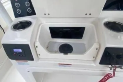  Yacht Photos Pics 2022 Robalo R302 Center Console boat dashboard with cup holders and control panel.