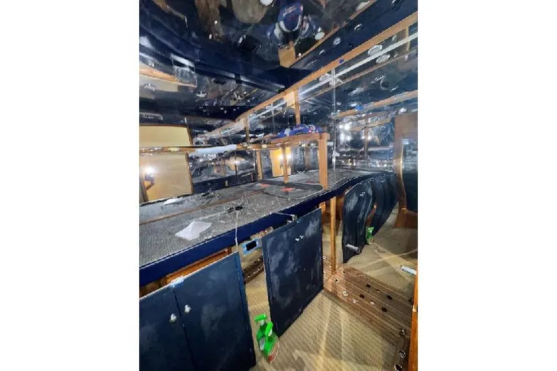  Yacht Photos Pics Interior of a 1994 Bertram 60 Convertible yacht, featuring storage and reflective surfaces.