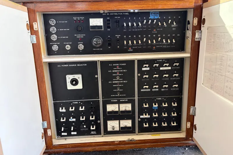  Yacht Photos Pics Electrical control panel inside a 1994 Bertram 60 Convertible yacht, featuring switches and gauges.