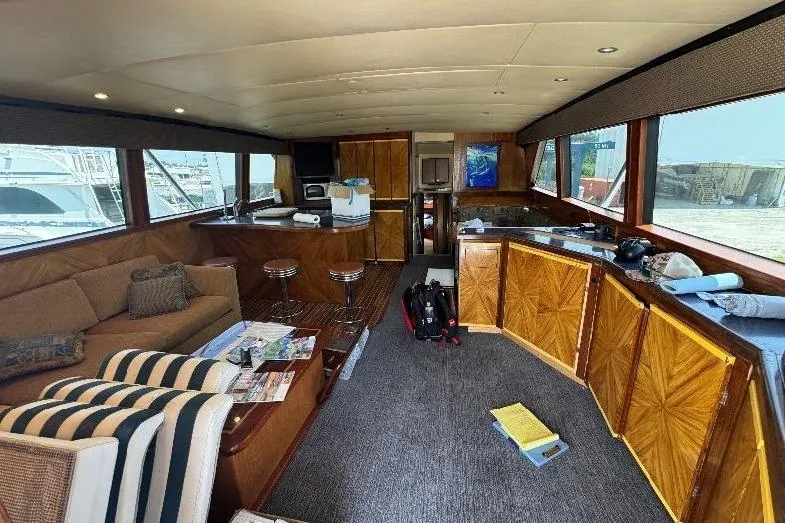  Yacht Photos Pics Luxurious interior of a 1994 Bertram 60 Convertible yacht with elegant wood finishes.