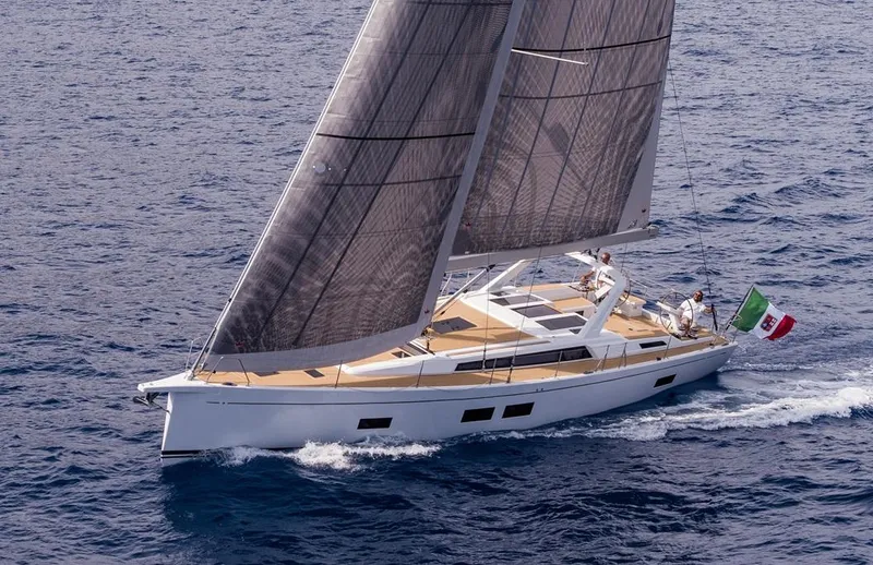  Yacht Photos Pics 2025 Grand Soleil 52 LC yacht sailing on open sea with Italian flag.