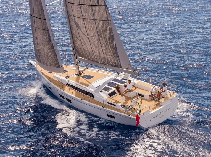  Yacht Photos Pics Sailing yacht Grand Soleil 52 LC 2025 cruising on open sea with two people onboard.