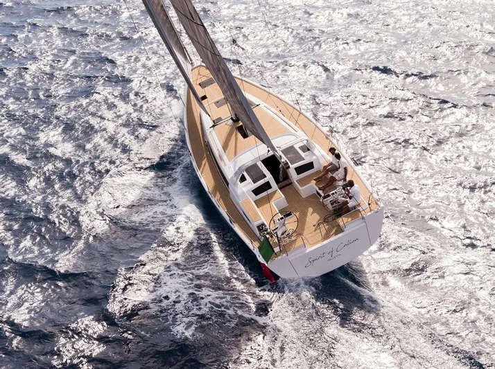  Yacht Photos Pics 2025 Grand Soleil 52 LC sailing on shimmering ocean waters.