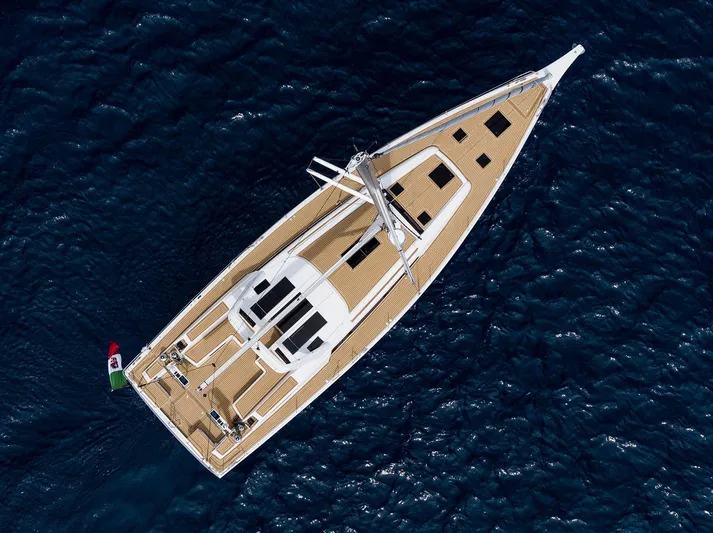  Yacht Photos Pics Aerial view of 2025 Grand Soleil 52 LC yacht sailing on deep blue ocean.