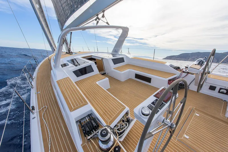  Yacht Photos Pics 2025 Grand Soleil 52 LC yacht sailing on open sea with elegant deck design.
