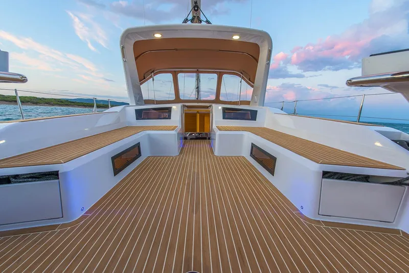  Yacht Photos Pics 2025 Grand Soleil 52 LC yacht deck with elegant wood finish at sunset.