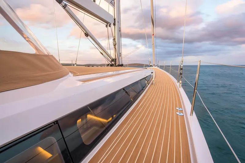  Yacht Photos Pics 2025 Grand Soleil 52 LC yacht deck with ocean view and sunset sky.