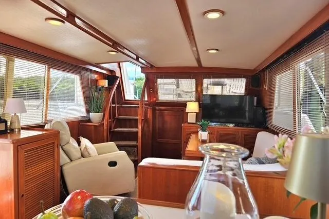 Southern Flite Yacht Photos Pics Luxurious 1990 Offshore Yachts Trawler interior with cozy seating and elegant wood finishes.