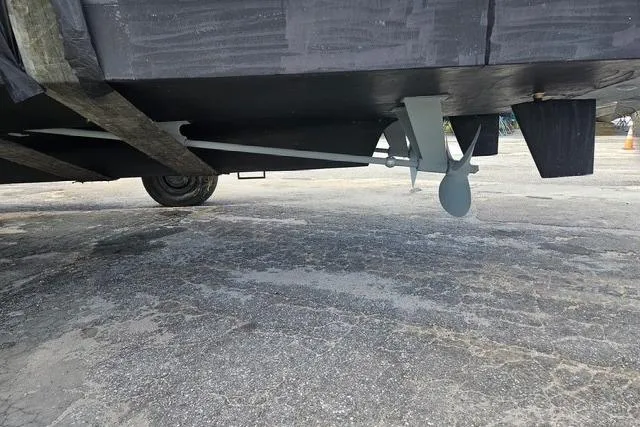 Southern Flite Yacht Photos Pics Underneath view of a 1990 Offshore Yachts Trawler, showcasing propeller and rudder.