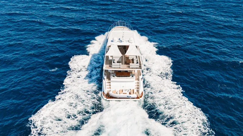 April Fools Yacht Photos Pics Azimut 80 Flybridge 2018 yacht cruising on open sea, aerial view.
