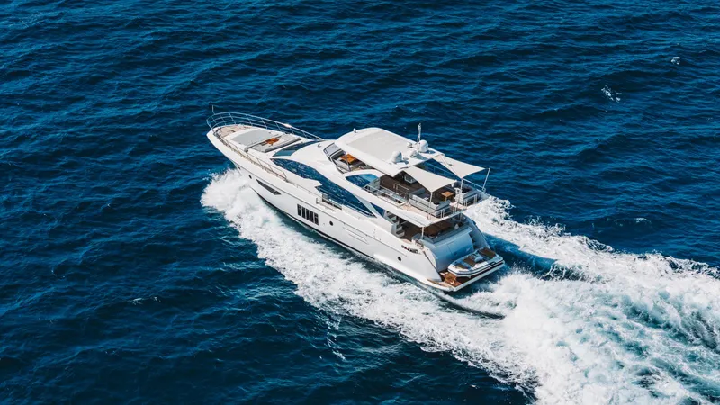 April Fools Yacht Photos Pics 2018 Azimut 80 Flybridge yacht cruising on open blue sea.