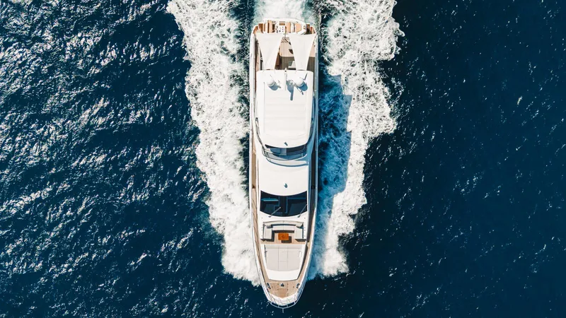 April Fools Yacht Photos Pics Aerial view of 2018 Azimut 80 Flybridge yacht cruising on open water.